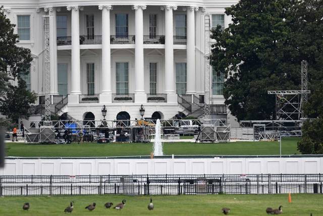 125564730_web1_TRUMP-SPEECH
Staging and scaffolding began to appear on the White House South Lawn last week, as seen here.
Susan Walsh | AP photo