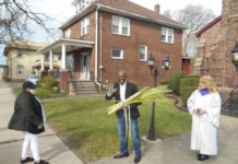 
			
				                                Pastor Adam McGahee, center, and his wife, Lisa, were giving out palm branches outdoors in front of Moving River Ministries, 439 S. Main St., Wilkes-Barre last year. The church’s Praise Team will be handing them out again this year, from 10 a.m. to noon on March 28.
                                 Mary Therese Biebel | Times Leader file photo

			
		