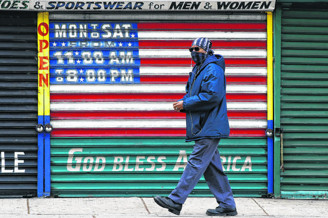126779730_web1_Jobless
A person wearing a protective face mask as a precaution against the coronavirus walks past a shuttered business in Philadelphia last year at the height of the pandemics shutdown. After a year of frustration over long waits for checks, jammed phone lines and confusing online filing procedures, Pennsylvanias Department of Labor and Industry is promising a much quicker and easier unemployment compensation claims filing system in two months.
AP file photo