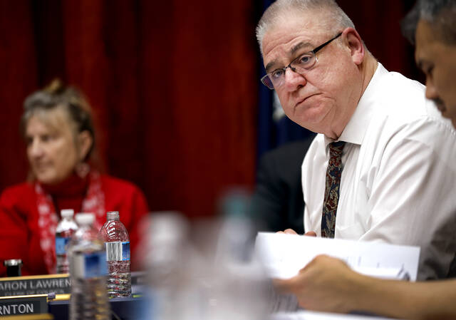 <p>Luzerne County Councilman Brian Thornton listens to another councilman answer a question he posed.</p>
<p>Fred Adams | For Times Leader</p>