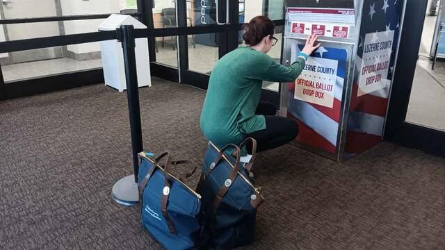129649051_web1_344573133_761396525637745_5362278536312050190_n
Luzerne County Election Operations Manager Emily Cook opens the mail ballot drop box at the Penn Place Building in downtown Wilkes-Barre for the last time Tuesday night to retrieve ballots.
Margaret Roarty | Times Leader