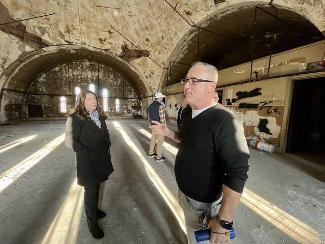 130135376_web1_IMG_8749
Luzerne County Councilwoman LeeAnn McDermott listens to Dale Parmenteri, treasurer of the nonprofit board spearheading restoration of the Irem Temple in Wilkes-Barre, during a tour last week. County council earmarked $500,000 in federal American Rescue Plan funds toward the project to restore and repurpose the North Franklin Street Irem structure to house an open-floor music/event venue and a museum showcasing local history.
Roger DuPuis | Times Leader