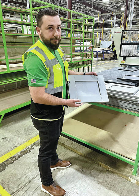 130410007_web1_wren1
Damian Gawronkiewicz, head of manufacturing operations at Wren Kitchens, holds one of the many styles of kitchen cabinetry the company manufactures in two large buildings in the Hanover Industrial Estates in Hanover Township and Sugar Notch and Warrior Run boroughs.
Kerry Miscavage | Times Leader