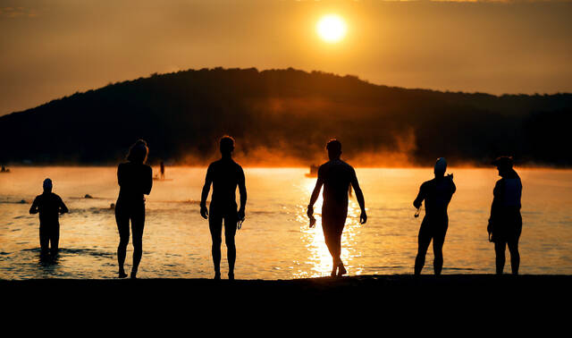 130567766_web1_tri1_faa
As the sun rises in the sky over Harveys Lake, triathletes survey the shore line and test the waters before the start of the Back Mountain Triathlon on Aug. 20, 2023.
Times Leader File Photos