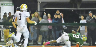
			
				                                Wyoming Area’s Lidge Kellum (2) manages to keep his balance after being tripped up to finish off a 56-yard touchdown run in the first quarter.
                                 Tony Callaio | For Times Leader

			
		