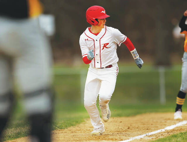 131411714_web1_red_leh1_faa
Holy Redeemers Dom Marranca scores from third base on an error in the first inning.
Fred Adams | For Times Leader