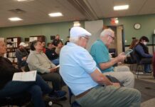 
			
				                                Penn Lake resident Ned McGuire, holding the tablet, joined others in voicing concerns Tuesday about the Luzerne County Flood Protection Authority’s leasing of unused space at its Forty Fort headquarters to the U.S. Department of Homeland Security.
                                 Jennifer Learn-Andes | Times Leader

			
		