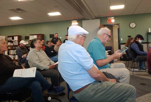 131527076_web1_fpa
Penn Lake resident Ned McGuire, holding the tablet, joined others in voicing concerns Tuesday about the Luzerne County Flood Protection Authoritys leasing of unused space at its Forty Fort headquarters to the U.S. Department of Homeland Security.
Jennifer Learn-Andes | Times Leader