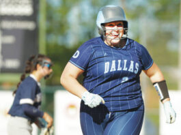 
			
				                                Dallas’ Carolyn Comitz is all smiles as she runs the bases after hitting a game-ending, three-run home run in the sixth inning.
                                 Fred Adams | For Times Leader

			
		