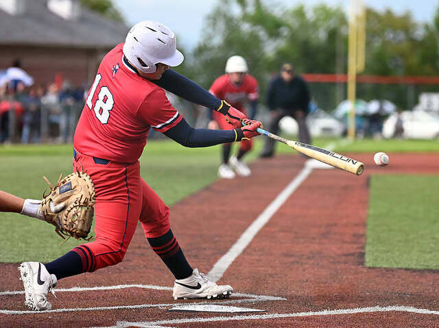 131535970_web1_PA-Dallas-bsbl-4
Pittston Areas Jacoby Harnen singles in Silvio Giardina in the second inning.
Tony Callaio | For Times Leader
