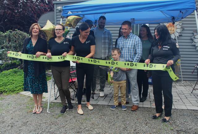 <p>Business owner Kaili Ignatz, third from the left, watches as her 5-year-old song, Mikey, prepares to cut the ribbon at the grand opening opening of her nail and waxing salon, Kaili’s LLC.</p>
                                 <p>Margaret Roarty | Times Leader</p>