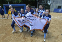 
			
				                                The Back Mountain 8-10 All-Stars run with the championship banner after winning the District 31 championship on Sunday.
                                 Mark Moran | For Times Leader

			
		