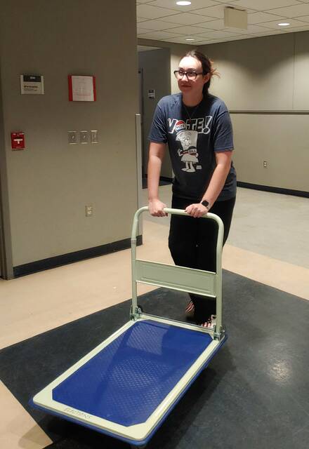 <p>County Election Director Emily Cook wheels a cart on Election Day in November.</p>
<p>Times Leader File Photo</p>