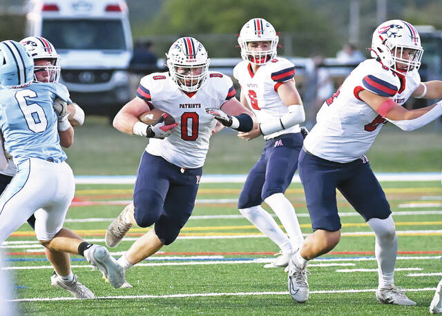<p>Pittston Area’s Brody Spindler (0) hits a huge hole to gain 12 yards against Dallas on Friday.</p>
<p>Tony Callaio | For Times Leader</p>