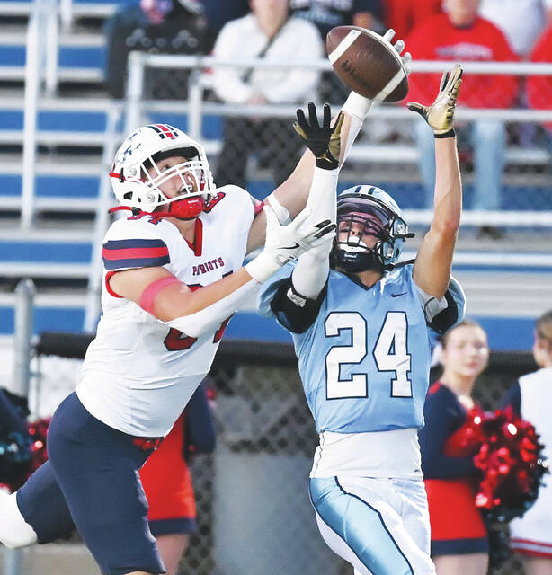 <p>Dallas’ Logan Geskey (24) battles Pittston Area’s John Jadus to come up with an interception for the Mountaineers on Friday.</p>
<p>Tony Callaio | For Times Leader</p>