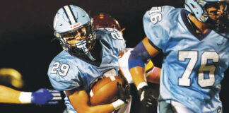 
			
				                                Dallas running back Sam Kelley picks up yards against Wyoming Valley West in the first quarter.
                                 Fred Adams | For Times Leader

			
		