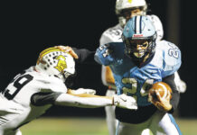 Geskey brothers shine as Dallas wins Old Shoe Game 
			
				                                Dallass Logan Geskey pushes Lake-Lehman defensive back Chris Yetter away as he goes for a touchdown in the second quarter.
                                 Fred Adams | For Times Leader