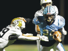 
			
				                                Dallass Logan Geskey pushes Lake-Lehman defensive back Chris Yetter away as he goes for a touchdown in the second quarter.
                                 Fred Adams | For Times Leader

			
		