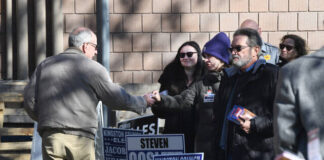 
			
				                                Campaign workers distribute cards as voters arrive at a polling place in Kingston on Tuesday.
                                 Mark Moran | For Times Leader

			
		