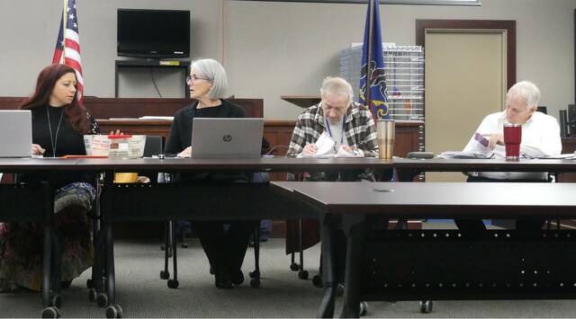 131912320_web1_adjudicate2
Luzerne Countys election board determined which general election provisional and flagged mail ballots must be accepted and rejected during Thursdays public adjudication. Board members, from left, are: Vice Chairwoman Alyssa Fusaro, Chairwoman Christine Boyle, Daniel Schramm, and Albert Schlosser. Board member Rick Morelli was absent.
Jennifer Learn-Andes | Times Leader