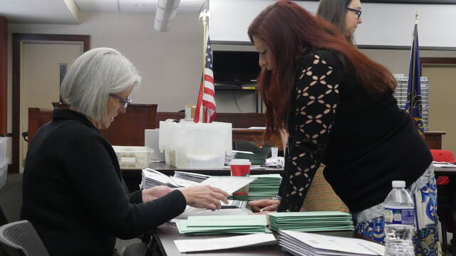 <p>Luzerne County’s Election Board Chairwoman Christine Boyle, seated, and Board Vice Chairwoman Alyssa Fusaro review a ballot during Thursday’s post-election adjudication.</p>
<p>Jennifer Learn-Andes | Times Leader</p>