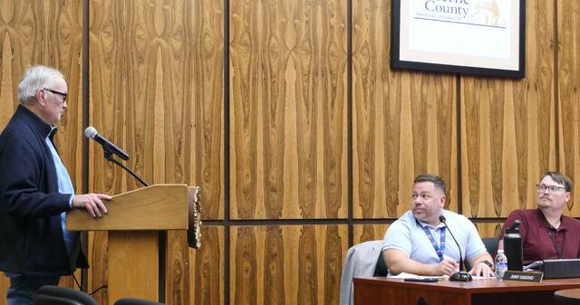 <p>Luzerne County Councilman Greg Wolovich, seated at right, invited county Controller-elect Tim McGinley to approach the podium at this week’s work session to discuss the proposed 2026 controller’s office budget. Councilman Jimmy Sabatino is seated at left.</p>
<p>Jennifer Learn-Andes | Times Leader</p>