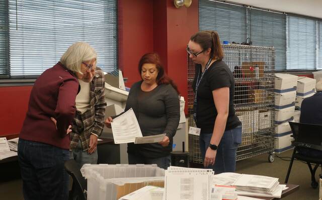 131926031_web1_adj4
Luzerne County election officials review a ballot during Wednesdays post-election adjudication. From left: county Election Board Chairwoman Christine Boyle, Board member Daniel Schramm, Board Vice Chairwoman Alyssa Fusaro and Election Director Emily Cook.
Jennifer Learn-Andes | Times Leader