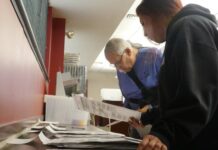 Several hundred test ballots found in Luzerne County’s unofficial results due to a Dominion Voting Systems error
Luzerne County Election Board member Albert Schlosser and board Vice Chairwoman Alyssa Fusaro sort Nov. 4 general election ballots for one of two state-required audits Monday.
Jennifer Learn-Andes | Times Leader