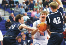 Dallas boys basketball rallies, routs Abington Heights
Dallas Pat Flanagan (10) looks to the basket as Abington Heights Andrew Kettle (14) and Brady Comstock double team him in the first quarter. Flanagan finished with 20 points and 11 rebounds.
Fred Adams | For Times Leader