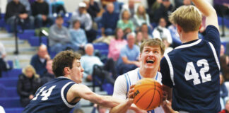 
			
				                                Dallas Pat Flanagan (10) looks to the basket as Abington Heights Andrew Kettle (14) and Brady Comstock double team him in the first quarter. Flanagan finished with 20 points and 11 rebounds.
                                 Fred Adams | For Times Leader

			
		
