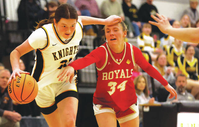 <p>Lake-Lehman’s Kathryn Morgan fends off Holy Redeemer’s Gillian Parsons while bring the ball down court in the first quarter.</p>
<p>Fred Adams | For Times Leader</p>