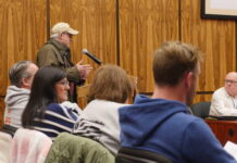 Luzerne County Council rejects election ordinance, fills many board seats
Hazleton resident James Ferry, an election poll worker, urged Luzerne County Council Tuesday to support an election protection ordinance as Councilman Steve Coslett, at right, listens to the public comment.
Jennifer Learn-Andes | Times Leader