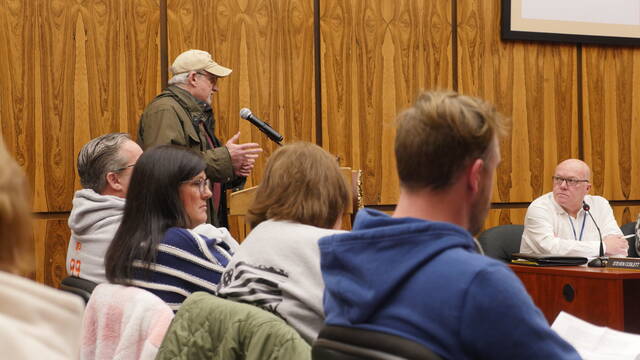 132092364_web1_pollworker
Hazleton resident James Ferry, an election poll worker, urged Luzerne County Council Tuesday to support an election protection ordinance as Councilman Steve Coslett, at right, listens to the public comment.
Jennifer Learn-Andes | Times Leader