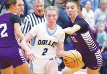 D2 Girls Basketball: Dallas uses defense to advance to 5A semis
Caitlyn Mizzer of Dallas moves the ball as Wallenpaupacks Abby Cykosky defends in the first quarter.
Fred Adams | For Times Leader