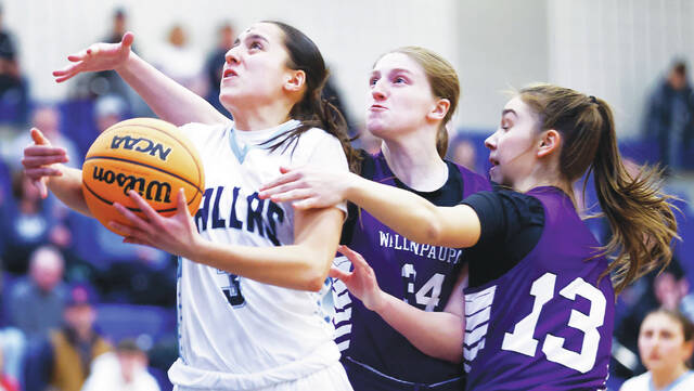 <p>Dallas’ Mia DelGaudio pushes between Wallenpaupack defenders Ashley Vanderputten (34) and Abby Cykosky (13) in the second quarter.</p>
<p>Fred Adams | For Times Leader</p>