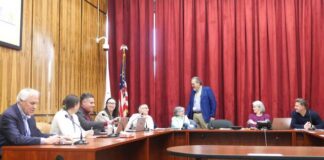 
			
				                                Luzerne County Administrative Services Division Head Jim Rose, standing, welcomes Audrey Serniak back to the county Election Board before Wednesdays meeting. She was appointed to a vacant seat by County Council in January. Also shown, from left, are county: Deputy Election Director Steve Hahn; Deputy Election Chief Clerk Amanda Latoski; Assistant Solicitor Gene Molino; Election Director Emily Cook; and Election Board members Albert Schlosser, Chairwoman Christine Boyle, and Vice Chairman Rick Morelli.
                                 Jennifer Learn-Andes | Times Leader

			
		
