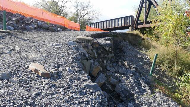 132363114_web1_fpause
A $650,150 project to stop erosion creeping toward part of the Wyoming Valley Levee wall in Wilkes-Barre is still on track to begin in the middle of June, Luzerne County Flood Protection Authority officials said during Tuesdays meeting. The impacted flood wall along Riverside Drive in Wilkes-Barre is behind the orange netting.
File Photo