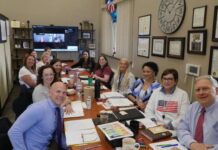 
			
				                                Luzerne Countys adult treatment court team meets for hours every Friday to review client case files at the courthouse. Shown clockwise, from the foreground at left: Tim Hlivia, probation officer; Maura Tunis, county defense attorney; Jennifer Weiss, senior probation officer; Laura Biga, lead treatment court case manager; Shannon Lai, treatment court case manager; Amanda Frandella, an addiction medicine fellow participating as an observer; Pat Matteo, a Volunteers of America representative assisting the team with housing matters; Princess Morgan, county prison treatment coordinator; Alex Zupancic, Wyoming Valley Drug and Alcohol Services counselor: Allyson Kacmarski, county DAs Office specialty court programs division chief; Aleesha Whitaker, assistant coordinator of treatment coordinators; Danielle T. Goldowski, county treatment courts coordinator; and county Court of Common Pleas Judge Joseph F. Sklarosky Jr. Shown on the remote screen at the rear is Jill Sprau, county drug and alcohol assistant administrator.
 
			
		