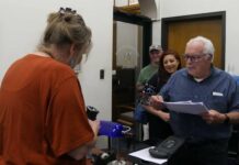 Citizens formally initiate process attempting to repeal Luzerne County anti-discrimination ordinance
Luzerne County Council Clerk Sharon Lawrence (behind desk) prepares to time-stamp a referendum petition filed Wednesday by Citizens Joe Granteed (at rear), Alyssa Fusaro, and Walter Griffith. The petition initiates a process attempting to throw out the County Councils new anti-discrimination ordinance.
Jennifer Learn-Andes | Times Leader