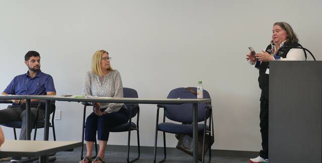 <p>Luzerne County Manager Romilda Crocamo, at right, briefs Thursday town hall attendees about road and bridge projects. Seated are county Operational Services Project Management Director Nick Vough and county Operational Services Division Head Michele Sparich.</p>
<p>Jennifer Learn-Andes | Times Leader</p>